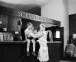 Primary view of [Woman and a child at an establishment, 2]