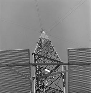 [Radio tower with panels]