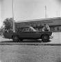 Photograph: [Ward Andrews cleaning a T-Bird]