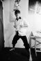 Photograph: [Photograph of a boy posing in a fighting stance]