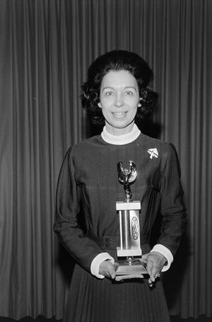 [Freda Holt posing with her trophy]