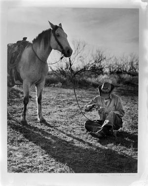 [Photograph of cowboy on horse]