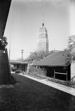[Photograph of the Tower Life Building behind shorter buildings]