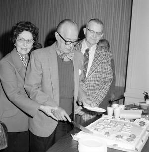 [Marshal Atwell cutting a cake]