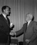 Photograph: [Photograph of James Byron shaking hands with a man at his retirement…