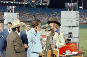 [Hank Williams Jr. and other musicians at the Country Gold Anniversary event]
