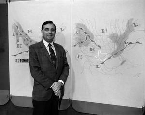 [Ron Godby and a weather map]