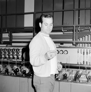 [Unknown man holding broadcasting equipment]