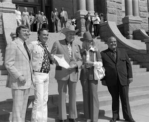 [Bill Mack, Sheriff Low Evans, Miss Ford Country, and Chubby Wise in front of the Tarrant County Courthouse, 2]