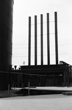 [Photograph of a building with five smokestacks]