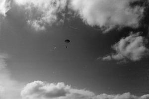[Photograph of a man parachuting]