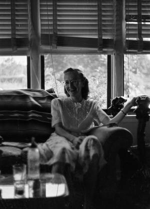 [Photograph of a woman on a couch, 3]