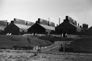 [Photograph of three buildings at an industrial site, 2]