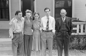 [Photograph of Charles, Frances, Irene, John, and Byrd Jr. posing in front of a house]