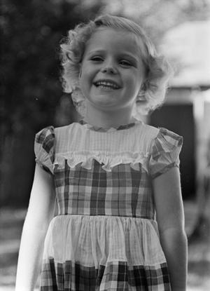 [Photograph of Carol Williams in a plaid dress, 4]