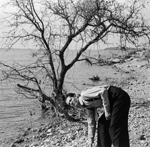 [Photograph of Byrd Williams III on a shore]