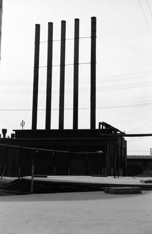 [Photograph of a building with five smokestacks, 3]