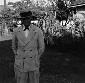 [Byrd Jr. posing in a suit outdoors, 3]