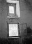 Photograph: [Photograph of an interior wall with two windows]