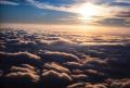 Photograph: [Aerial view of clouds and the sun]