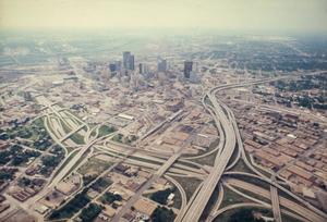 [Aerial view of Dallas freeways]