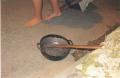 Photograph: [Empty Pot with wooden ladddle]
