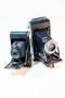 Photograph: [Kodak pocket camera and Kodak Monitor Six-16 camera angled together]