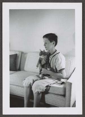 Primary view of object titled '[Photograph of Byrd Williams IV with a cat, 2]'.