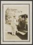 Photograph: [Man and two children with an automobile]