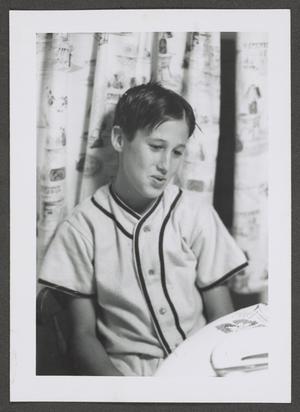 [Photograph of Byrd Williams IV at a table in a baseball uniform, 2]