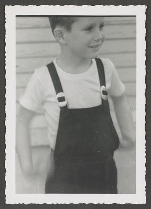 [Photograph of Tim Williams in overalls, 9]