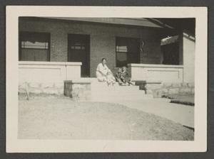 Primary view of object titled '[Irene, Charles, John and Byrd III on a porch]'.