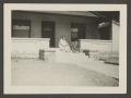 Photograph: [Irene, Charles, John and Byrd III on a porch]