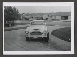 [Photograph of an automobile parked in a curved driveway]