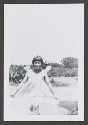 [Photograph of a girl running outside]