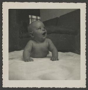 [Photograph of baby Paul on the floor]
