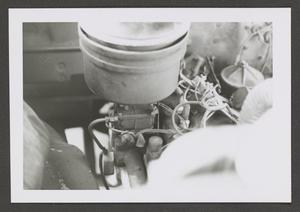 [Photograph of an automobile engine]