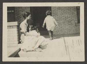 [Irene with Byrd III and John on a porch]