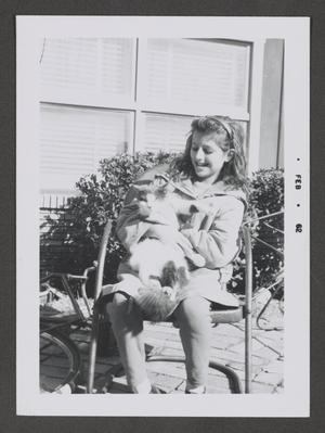[Young Pam holding a cat]