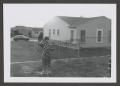 Primary view of [Photograph of Pam Williams standing in a backyard]