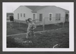 [Photograph of Pam Williams posing in a backyard, 2]