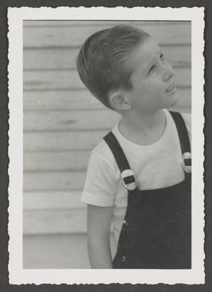 [Photograph of Tim Williams in overalls, 8]