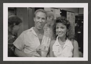 [Photograph of Ken Silvia and a woman at an event]