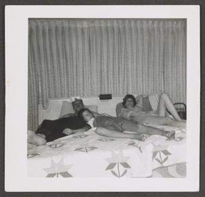 [Photograph of Byrd III, Pam, and Doris Williams lying in bed]