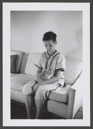 [Photograph of Byrd Williams IV with a cat]