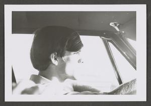 [Photograph of a young man driving, 2]
