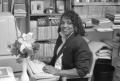 Photograph: [Dr. Sandra Terrell working at her desk]