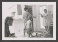 Photograph: [Photograph of Dovie, Byrd V, Derrick, and Pam in an apartment]