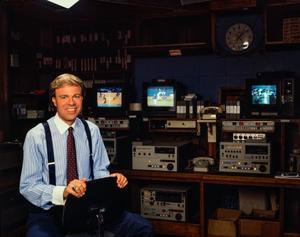 [Photograph of Scott Murray sitting in a room with monitors]