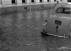 [Car in a flooded street]
